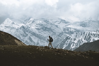 man standing on mountain