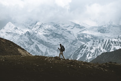 man standing on mountain