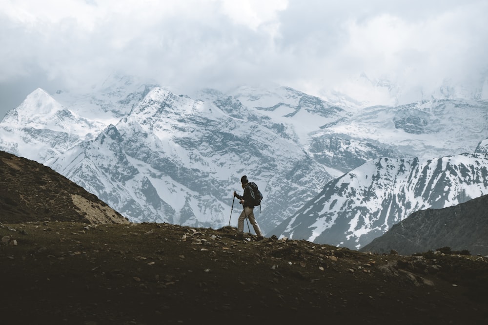 man standing on mountain