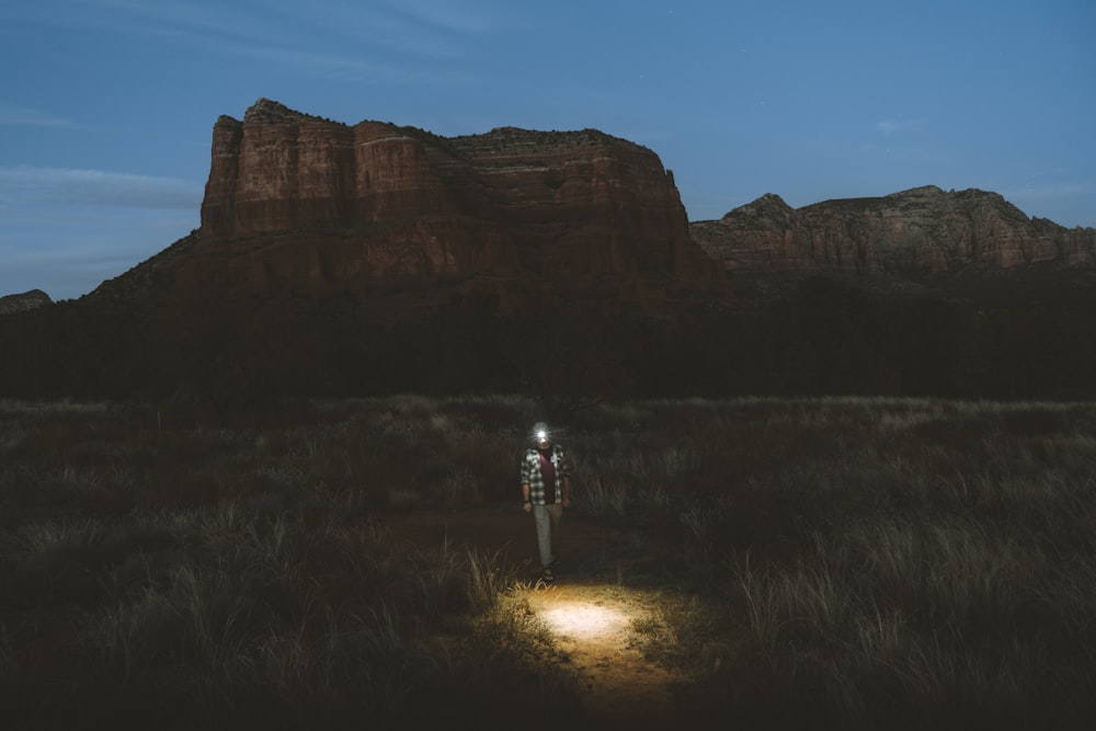 person walking near plateau