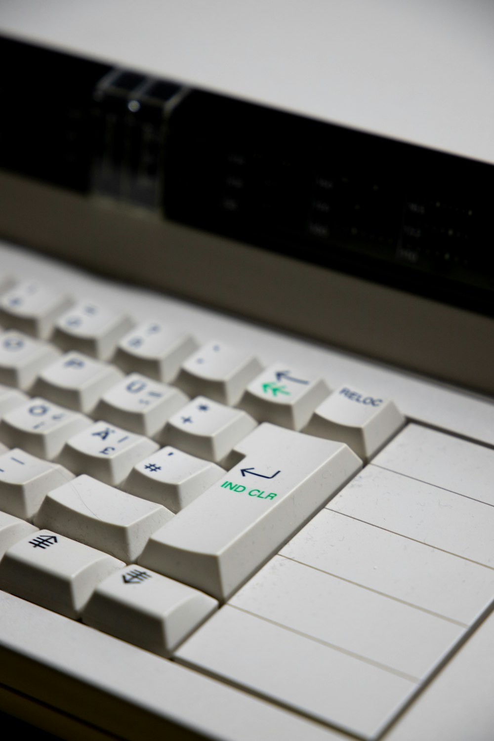 white computer keyboard on gray surface