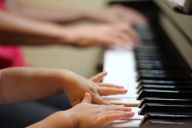 Student learning piano at a keyboard