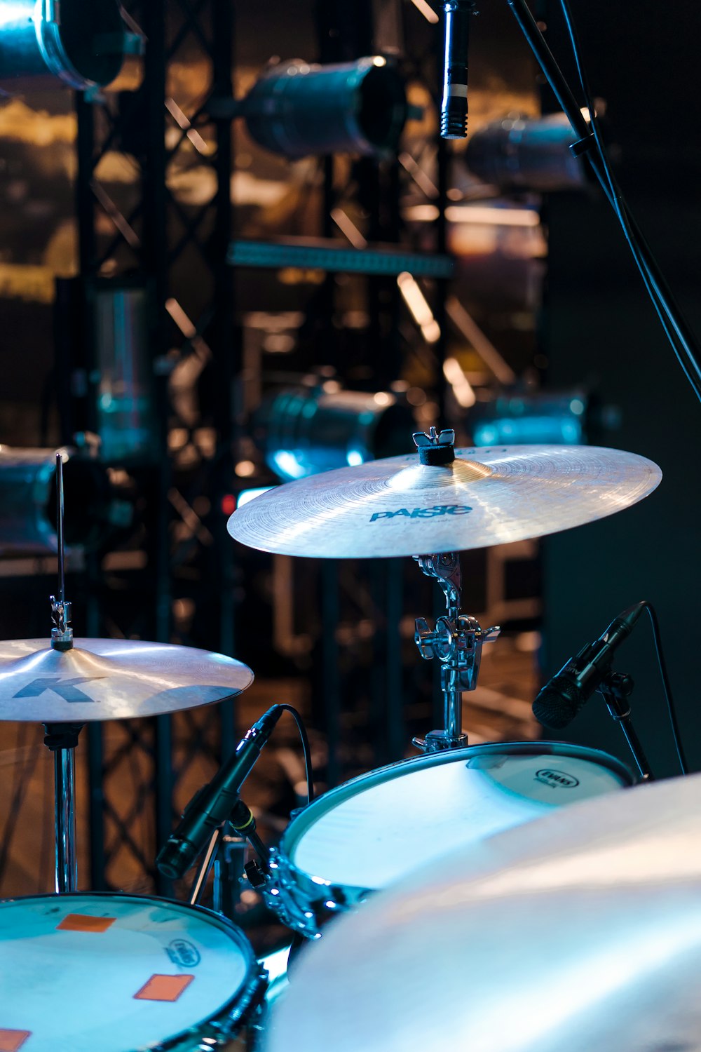 selective focus photo of gray and black cymbals