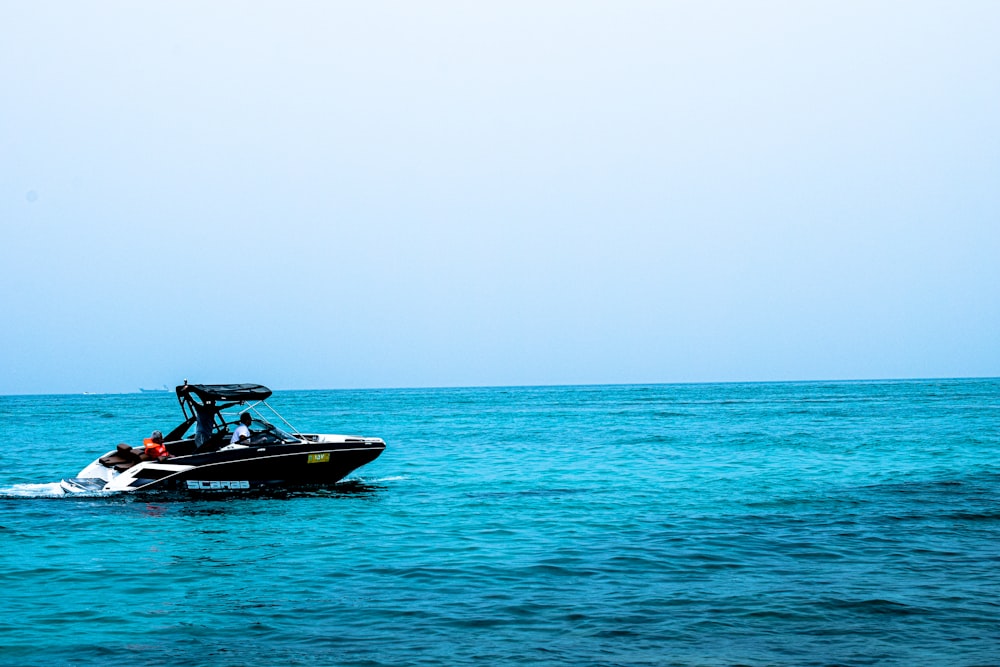 white and black motorboat