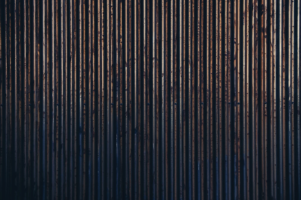 a black and brown background with vertical lines