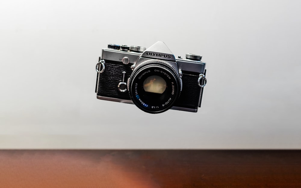 flat lay photography of black and gray Minolta camera