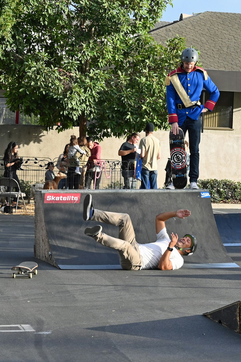 person playing skating lying on ground during daytime