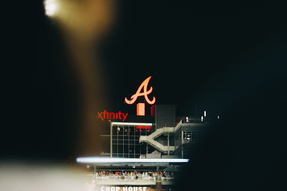 lighted Xfinity building at night