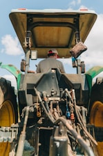 man riding tractor