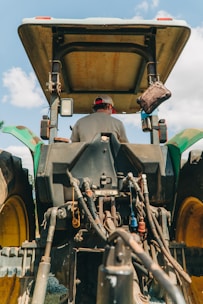 man riding tractor