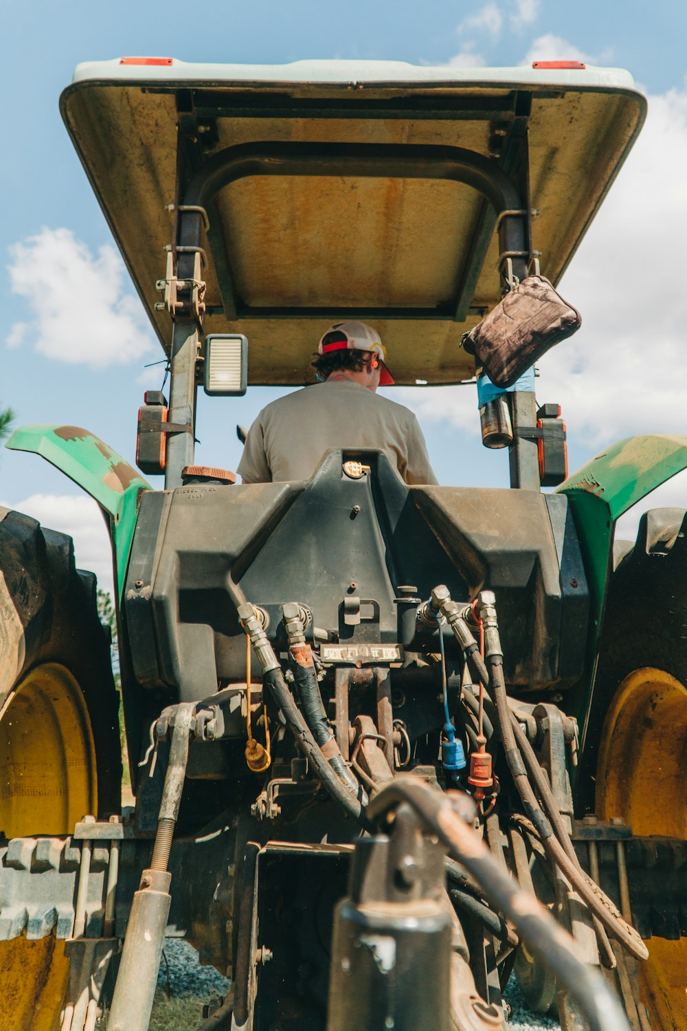 man riding tractor