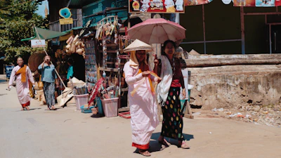 A summer street scene with girls in flowing ethnic skirts and casual tops.
