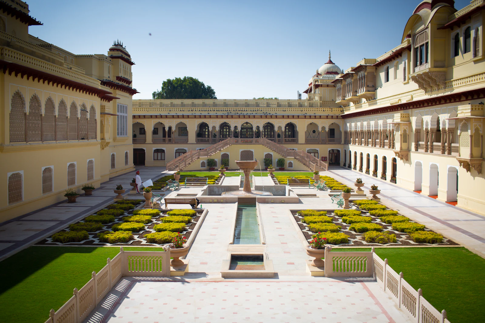 A heritage palace hotel courtyard, the kind of property marketed for destination weddings in India.