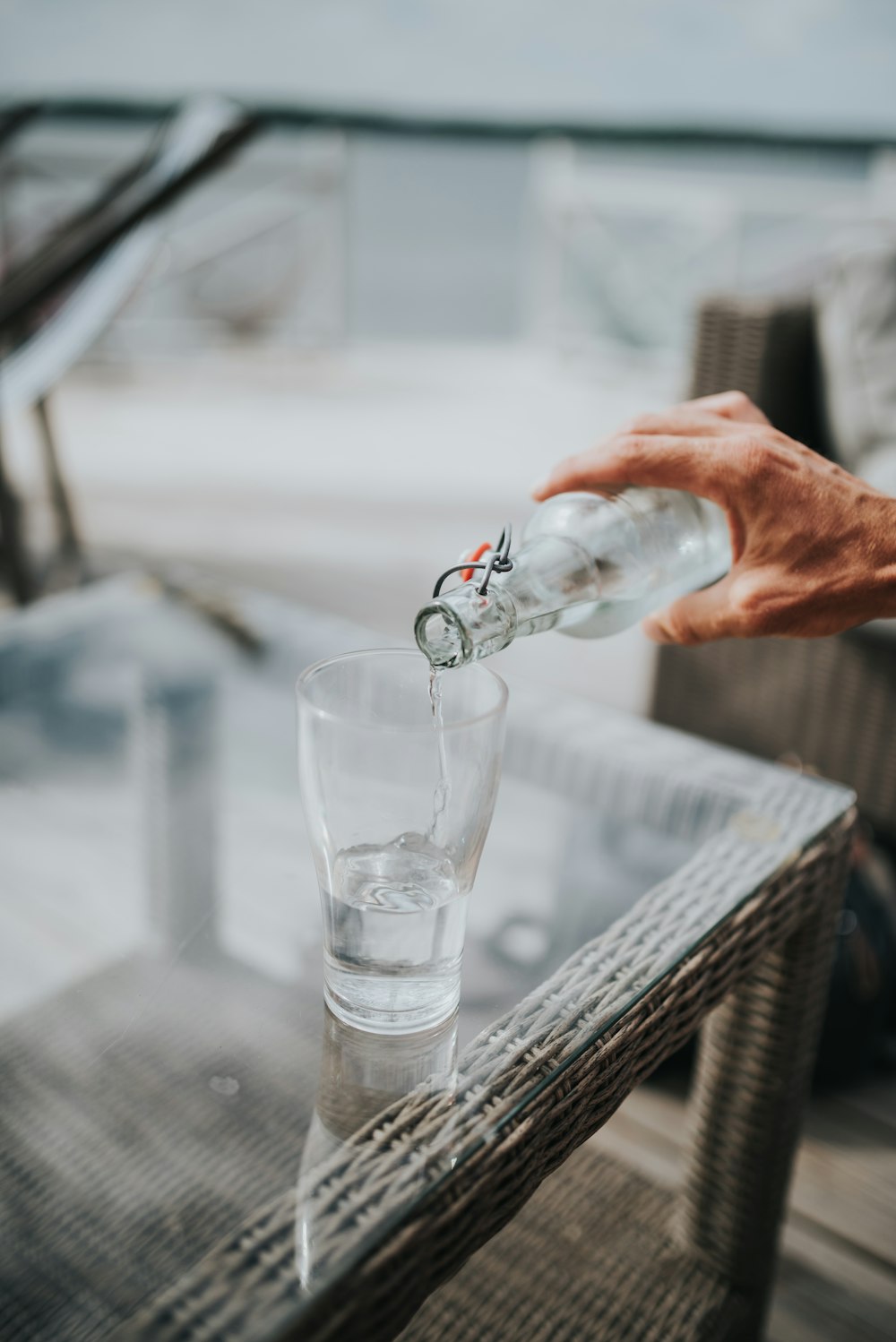 person pouring beverage