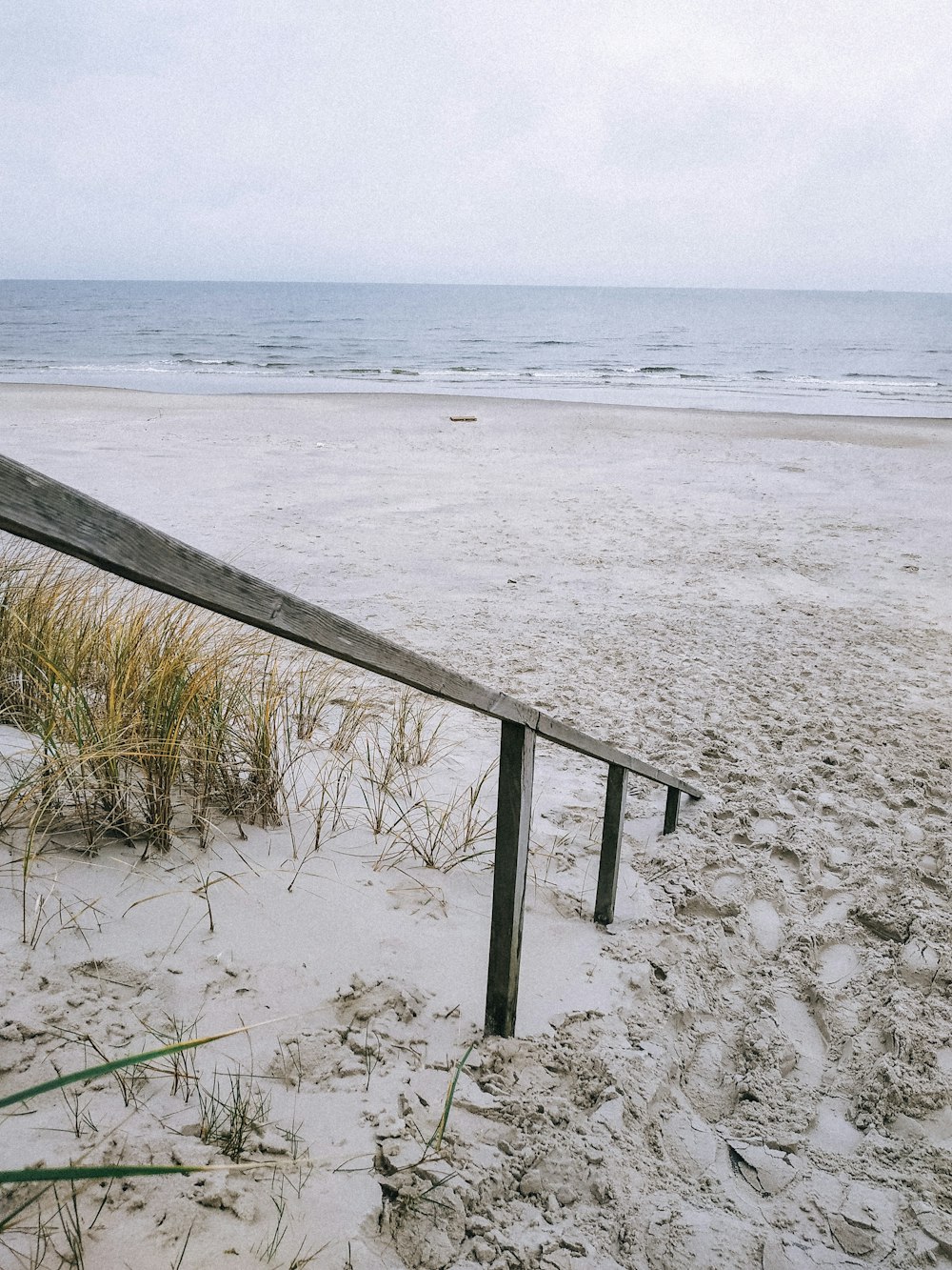 brown handrails at beach