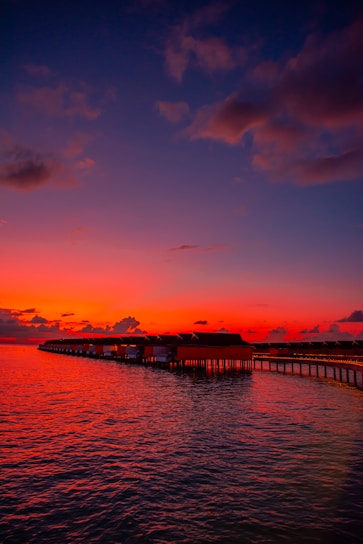 calm body of water during golden hour