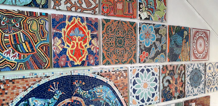 A vibrant display of colorful decorative tiles arranged artistically on a wall.