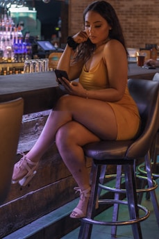 woman on bar chair