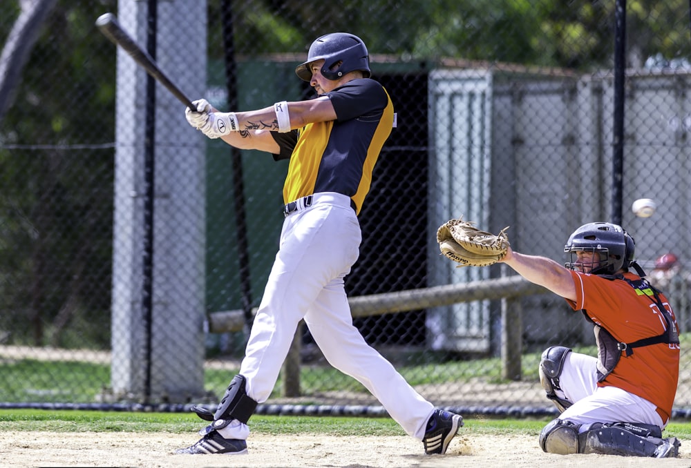 man batting in front of umpire