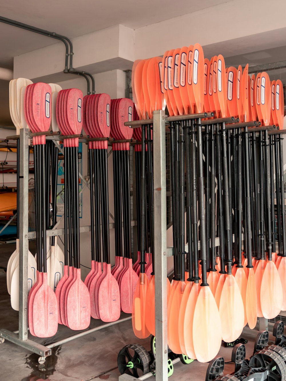 orange, red, and brown oars hanging up at an outpost