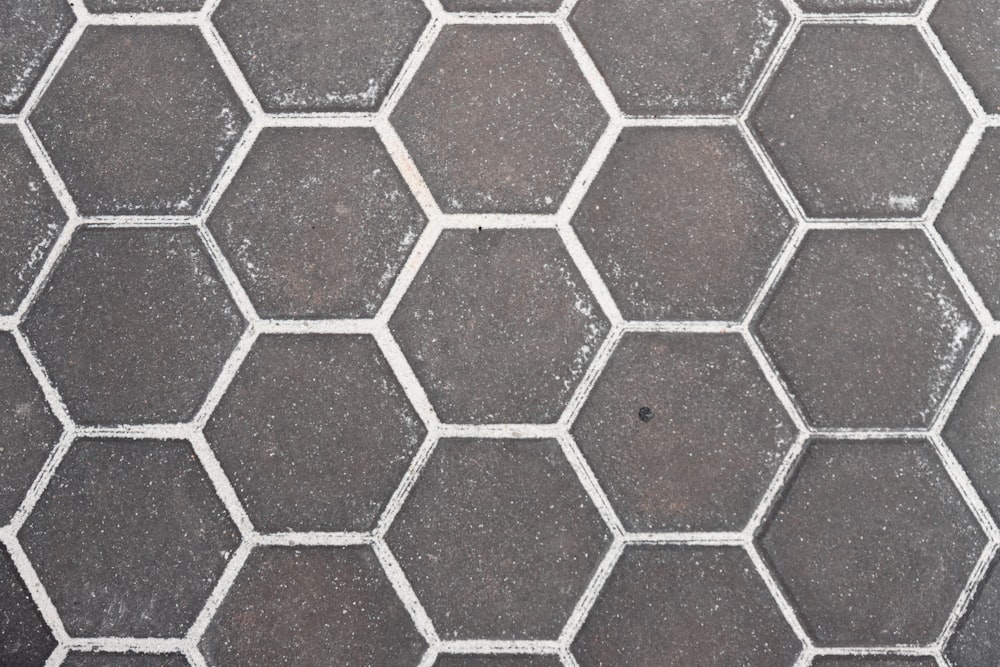 a black and white photo of a tiled floor