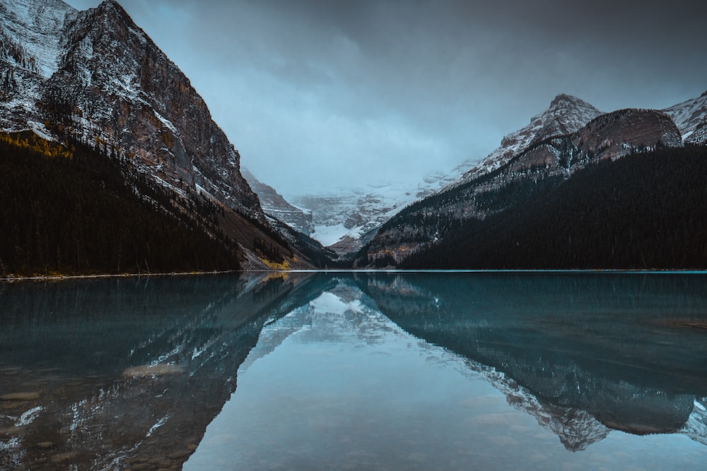 body of water near mountains