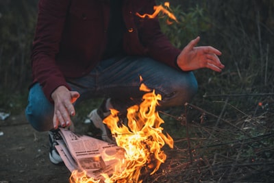 newspaper on fire