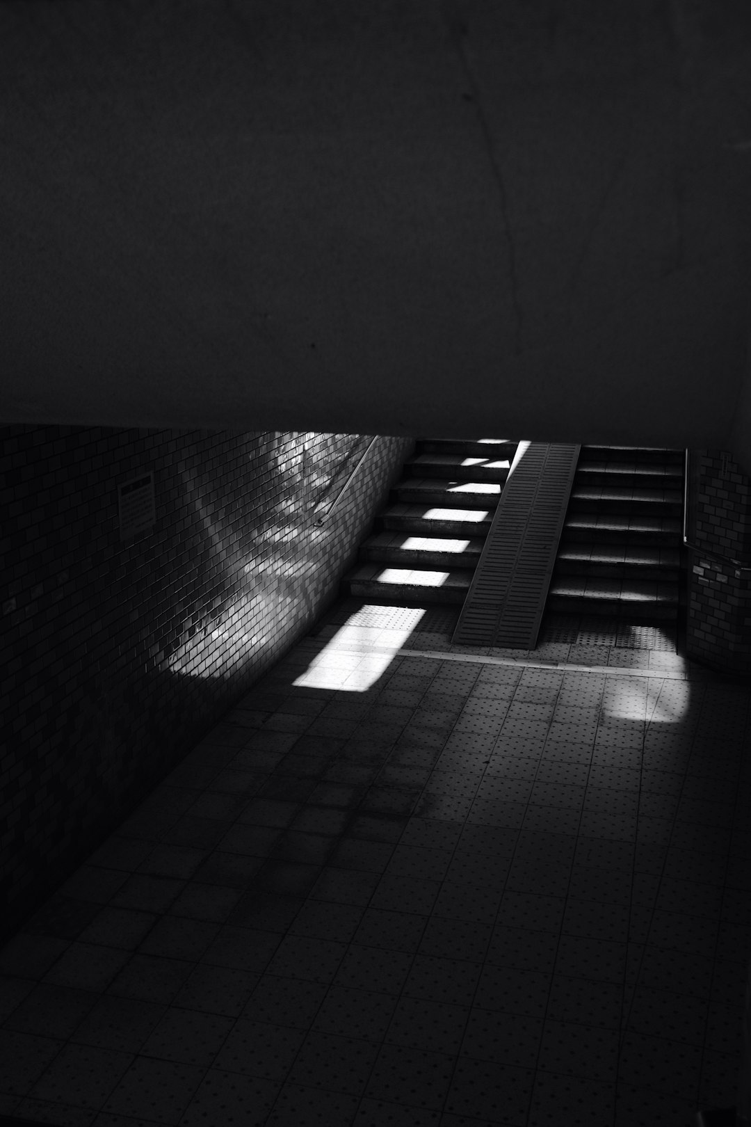 grayscale photography of subway