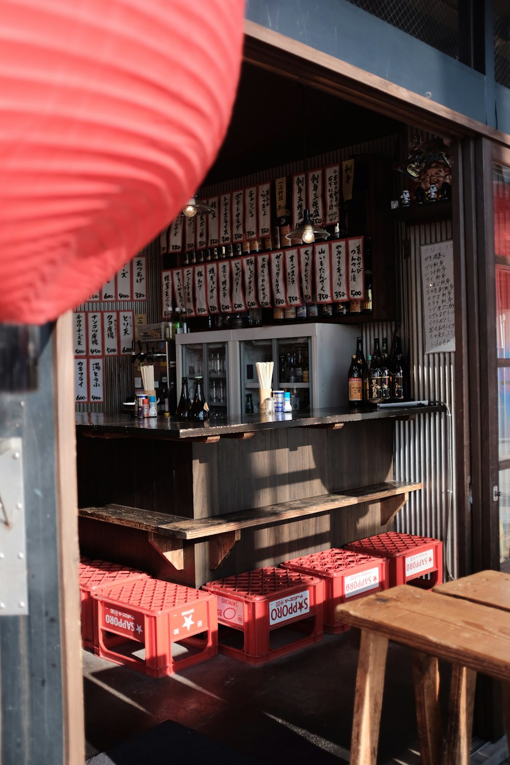 a small bar with a lot of red boxes in front of it