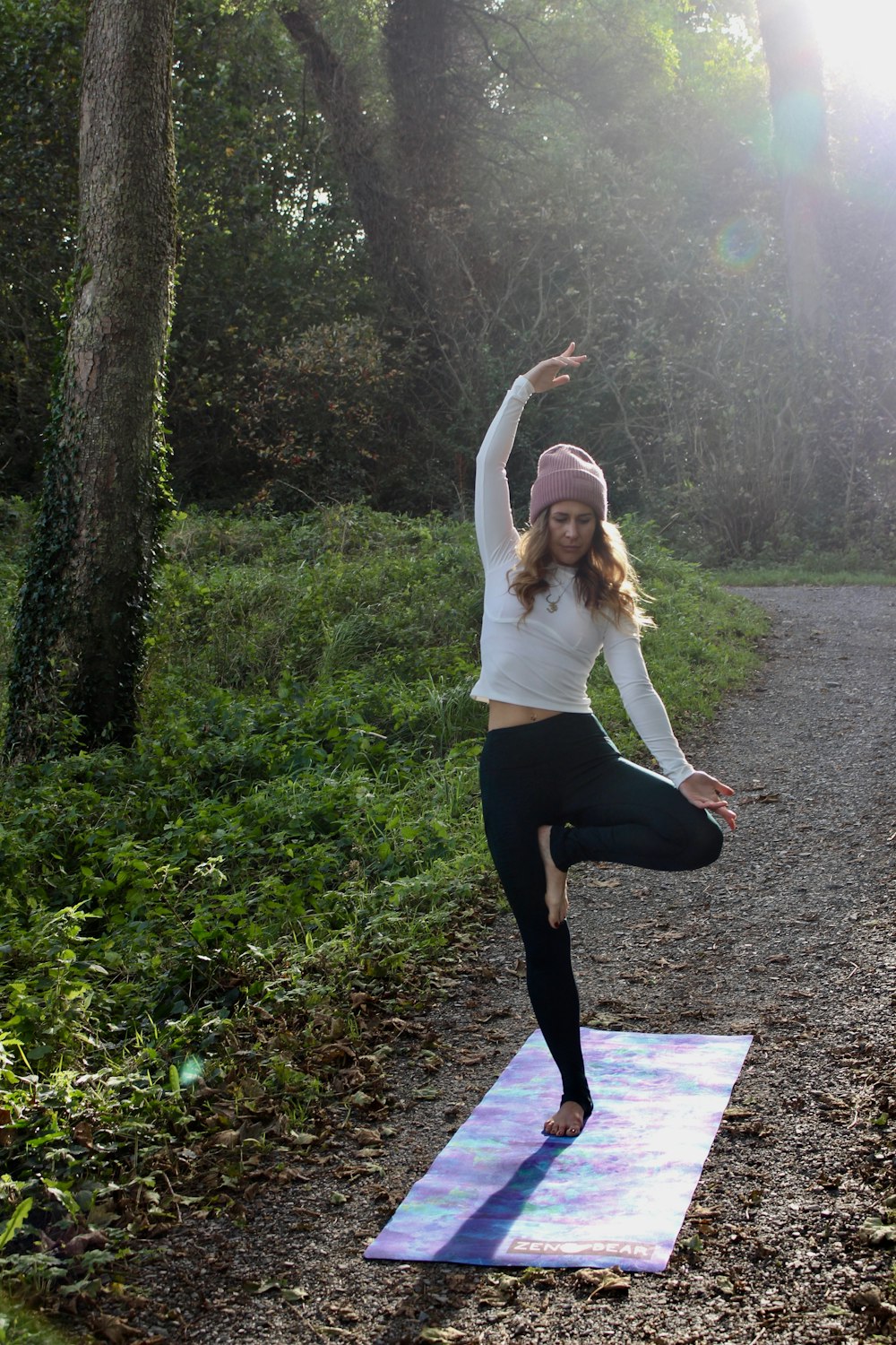 woman doing yoga post on mat