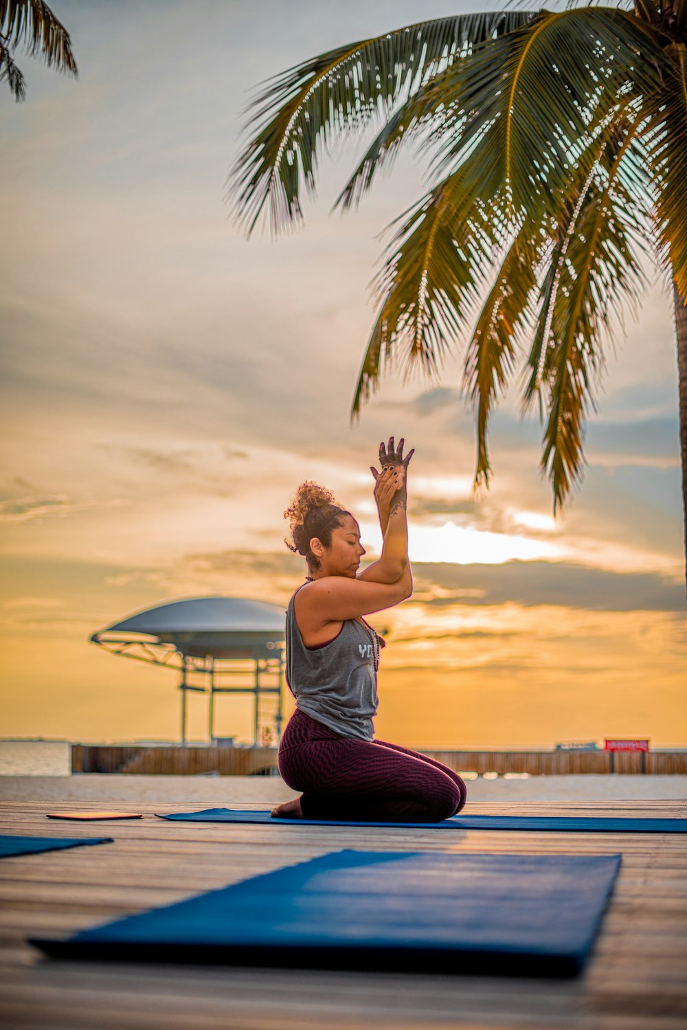 woman sitting on yoga mat