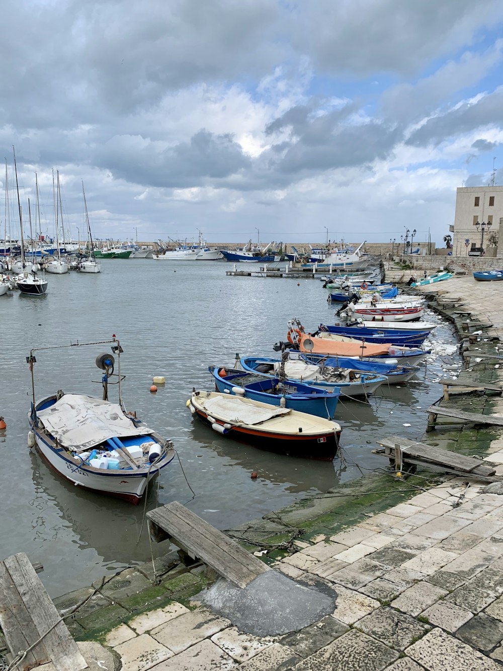 boats docked on pier during day