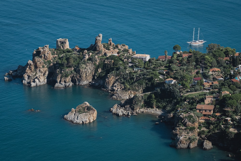 buildings on rocky island during day