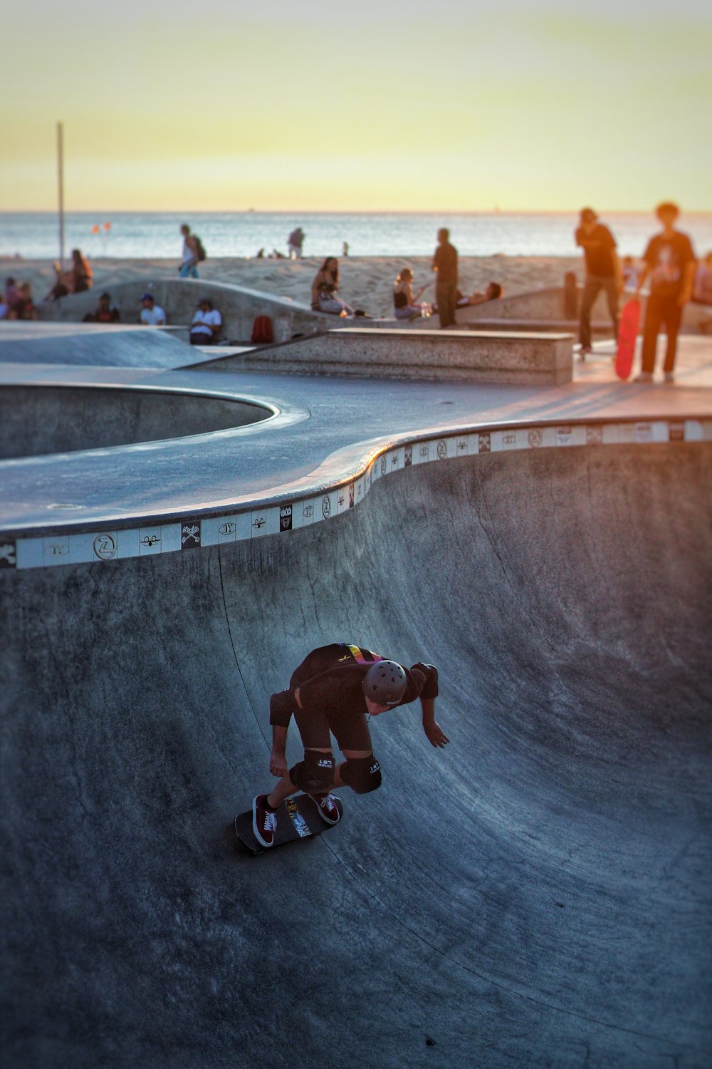 man doing skateboard tricks in a skateboard park