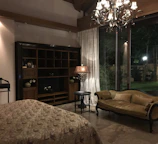 Classic room with queen bed, tasteful decor, and bright natural light.