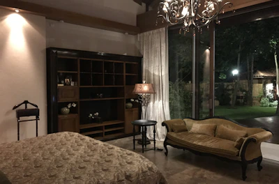 Classic room with queen bed, tasteful decor, and bright natural light.