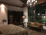 A spacious double room with natural light and comfortable seating.