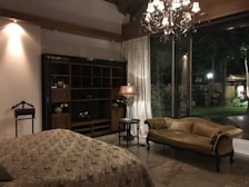 A cozy private suite featuring elegant decor, soft lighting, and a peaceful ambiance for rejuvenation.