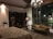 A serene and spacious room with natural light and tasteful decor, perfect for relaxation.