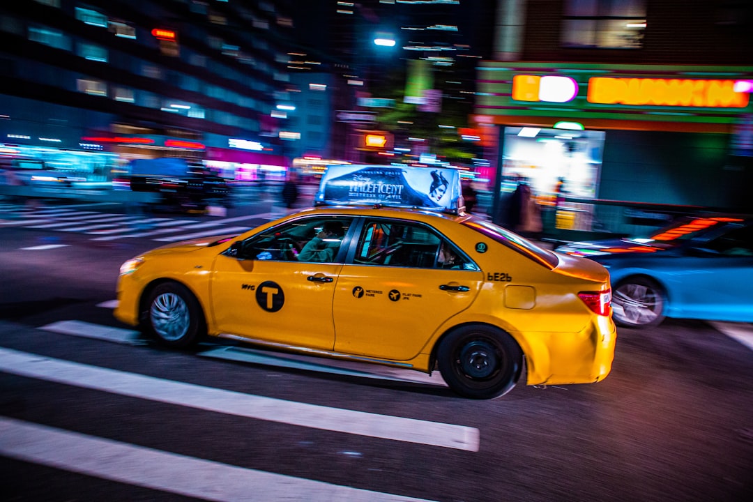 yellow cab on road