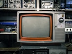 grey and orange CRT TV