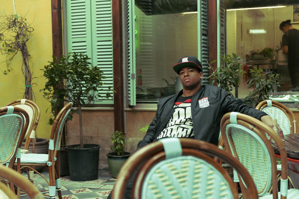 man wearing black fitted cap