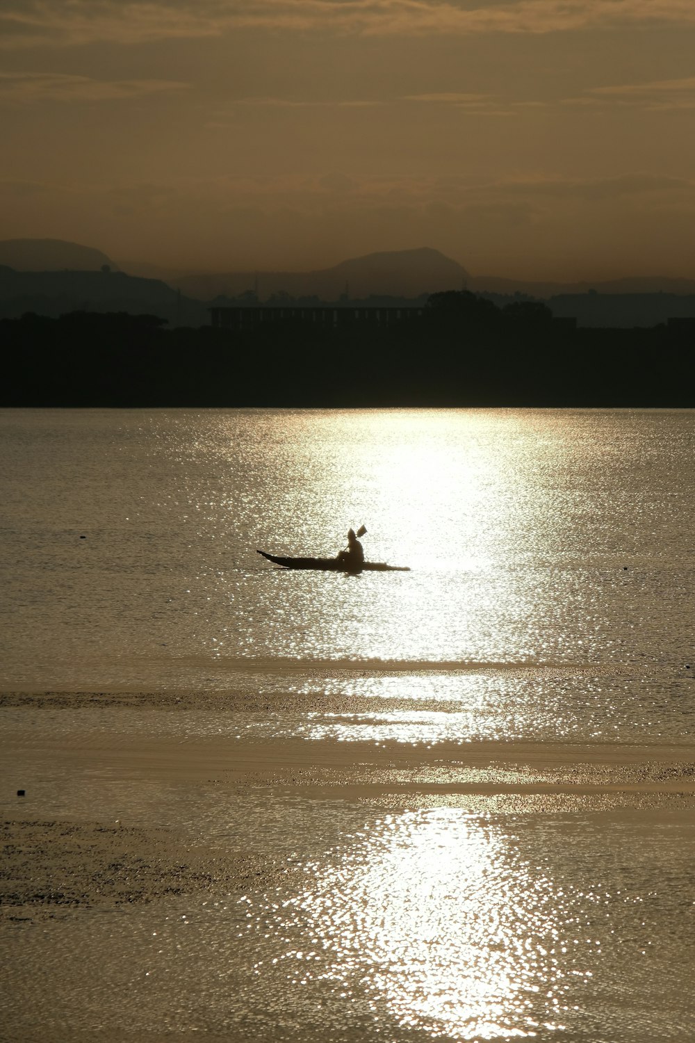 silhouette of person on boat