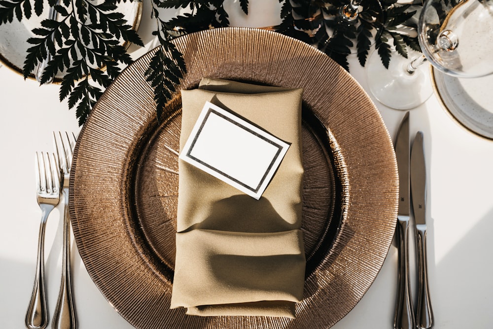 gray card on folded table napkin