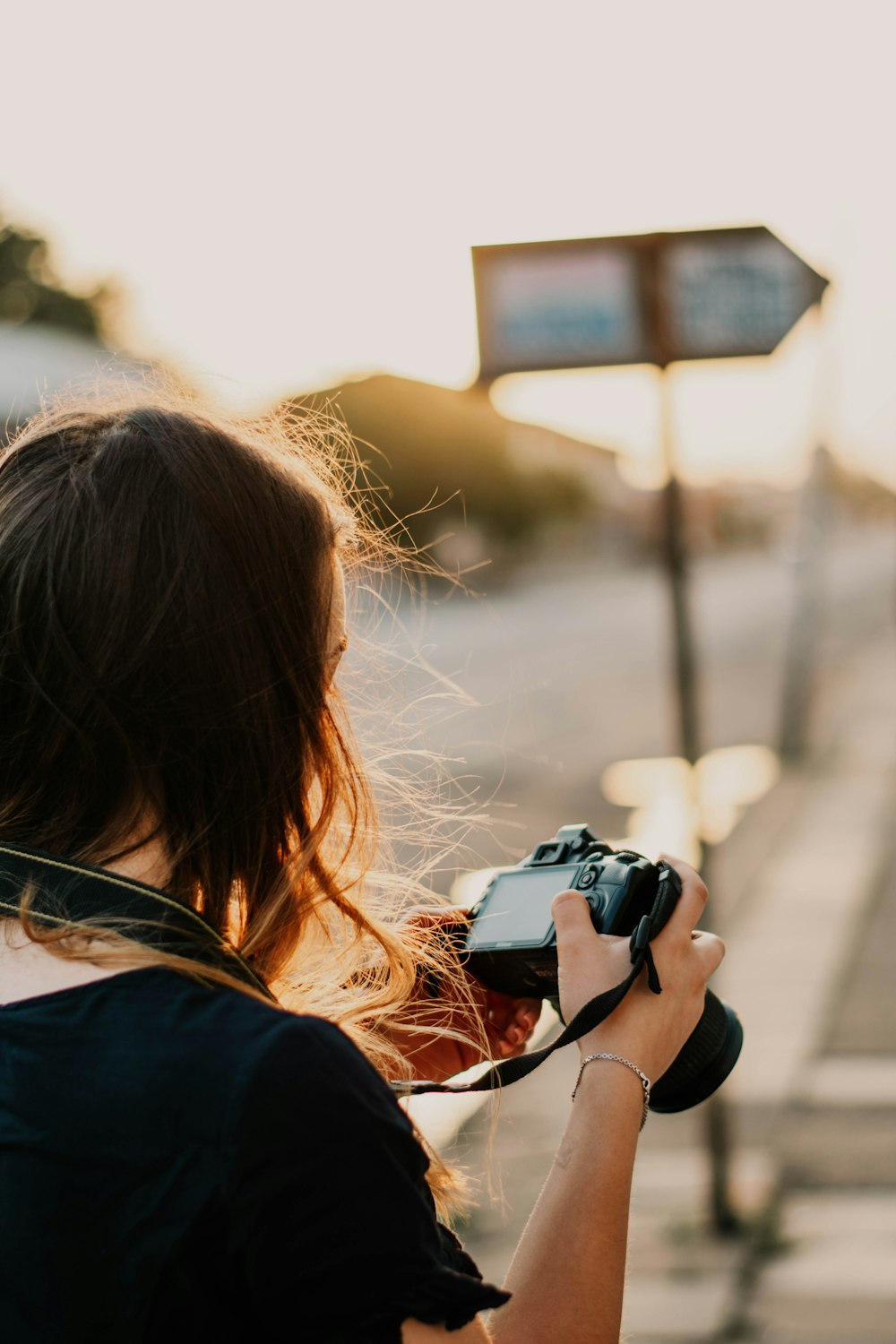 woman holding DSLR camera