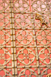 A designer sketching website layouts inspired by vintage door motifs.