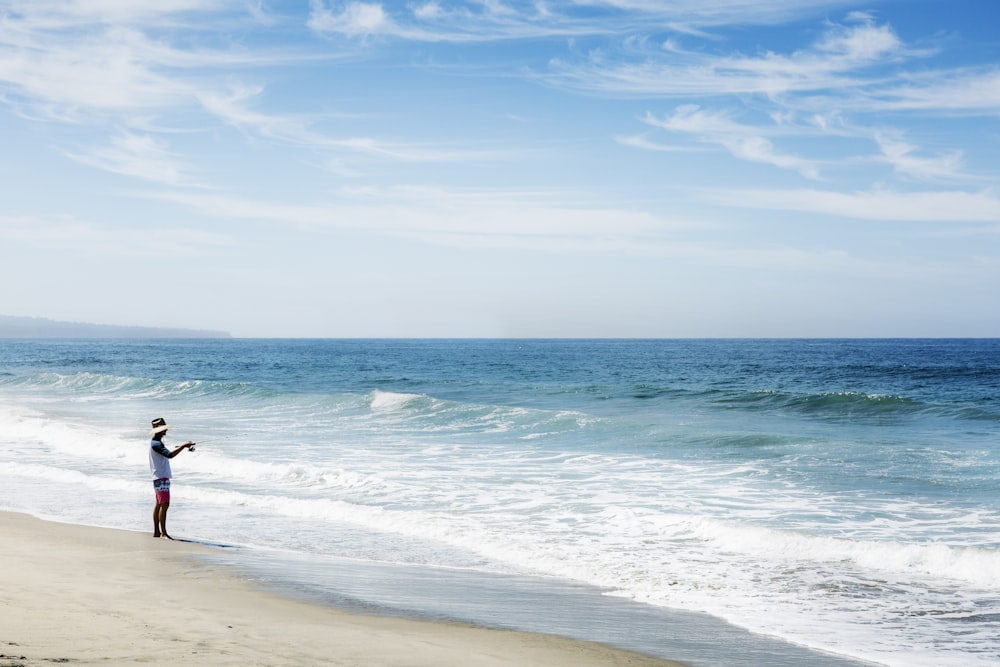 man standing on shore