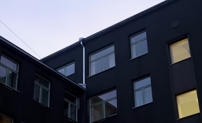 Exterior view of a SOC2 Type 2 certified data center building at dusk.
