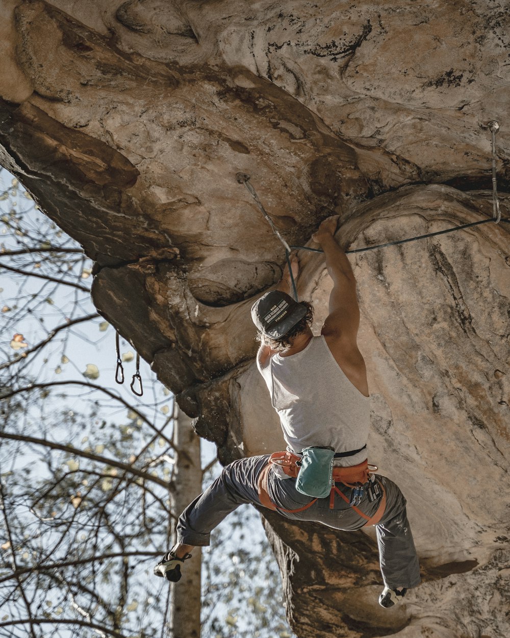 man climbing rock