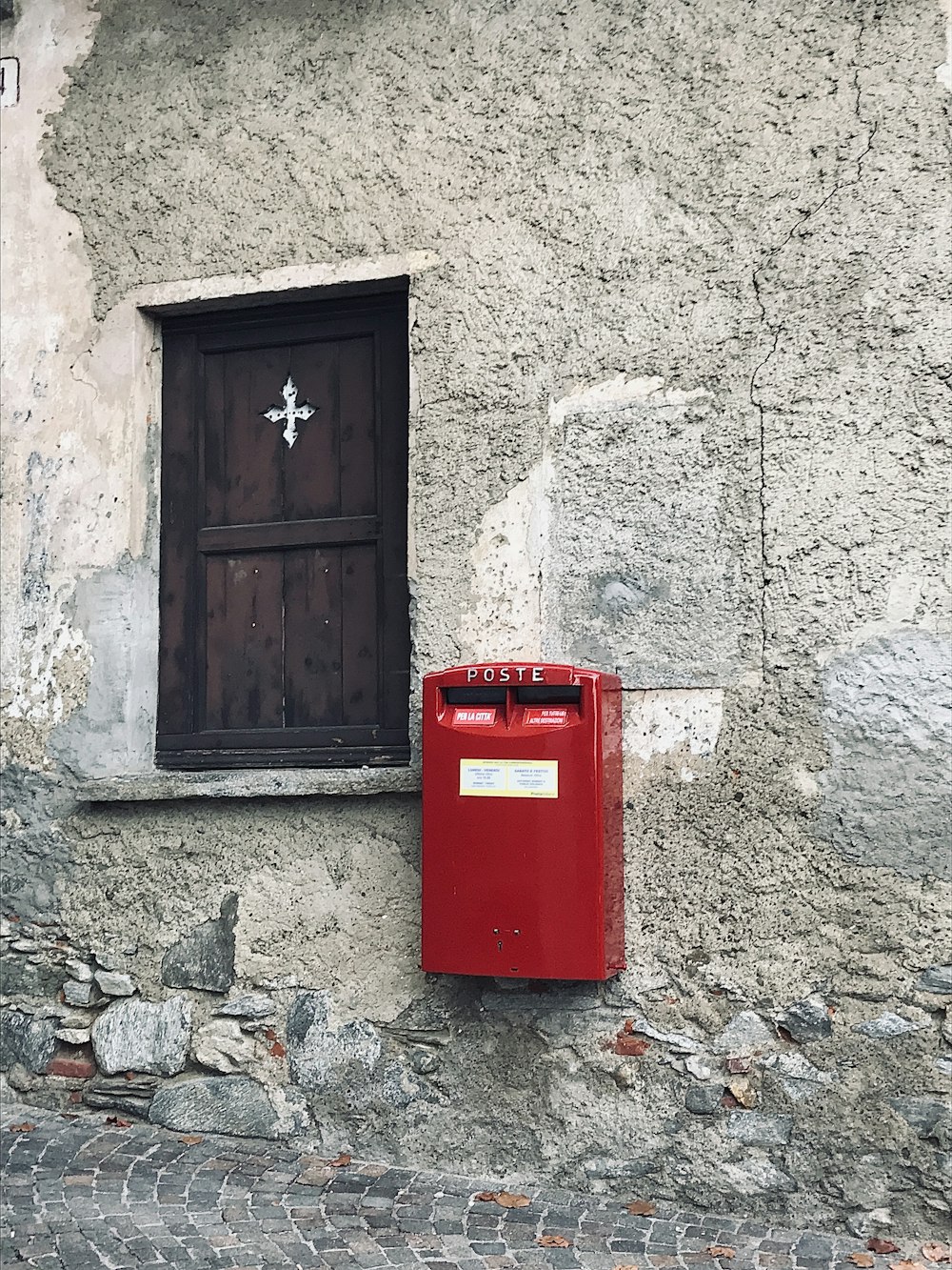 rectangular red metal mailbox